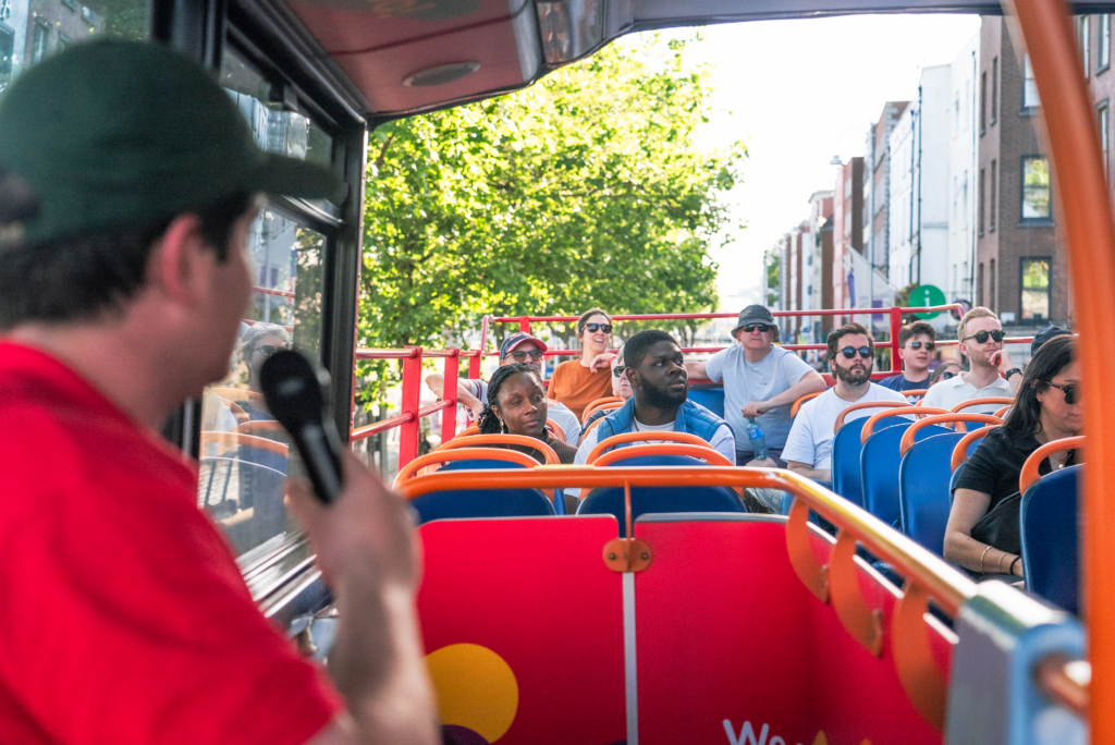 tourists on hop on hop off bus tour citysightseeing Dublin